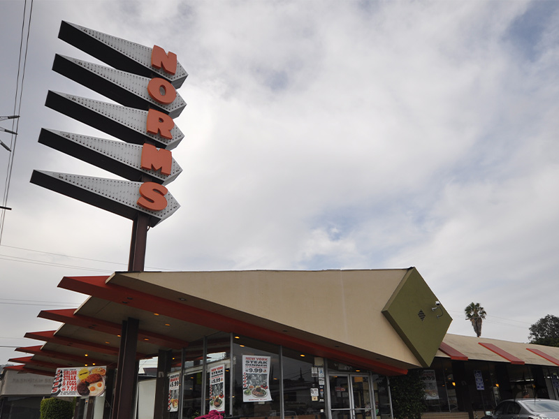 Norms neon sign in daytime